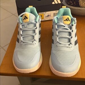 Adidas woman's Sky Blue Sneakers with Yellow Accents